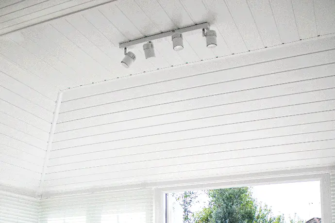 Inside image of a conservatory with a wooden ceiling finish