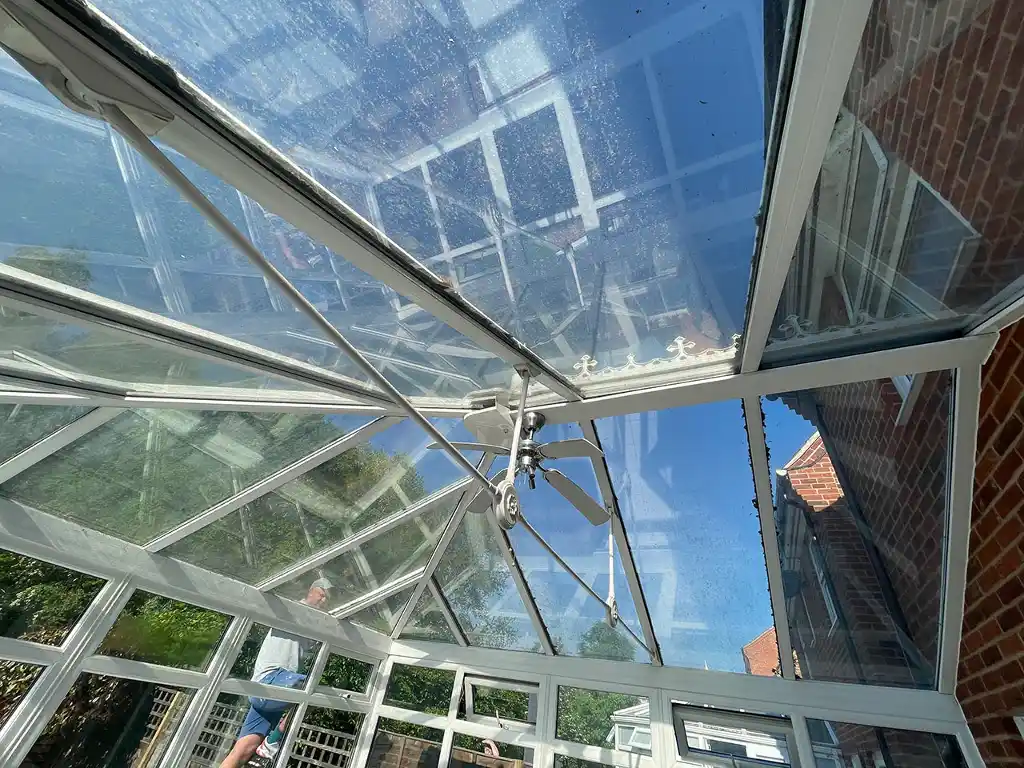 Inside shot of an old glass conservatory roof
